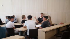 Students sitting in a classroom working together on a case.