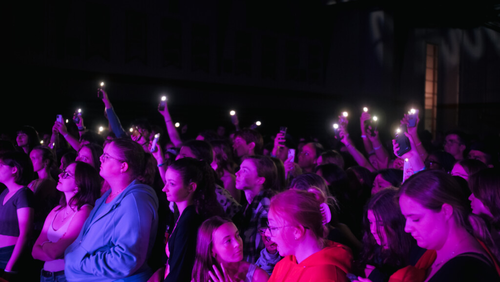 Students in the crowd at concert.