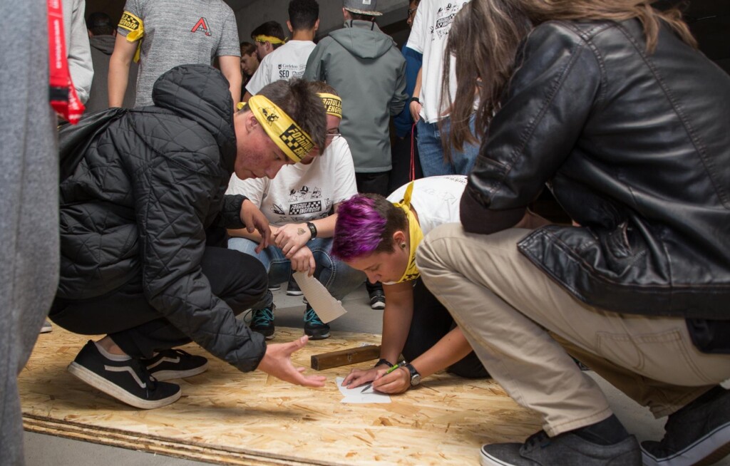 students working on a raft.