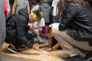 students working on a raft.