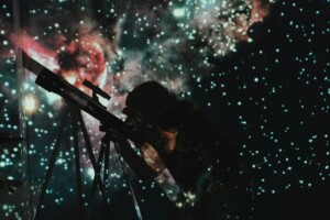 Student using a telescope.