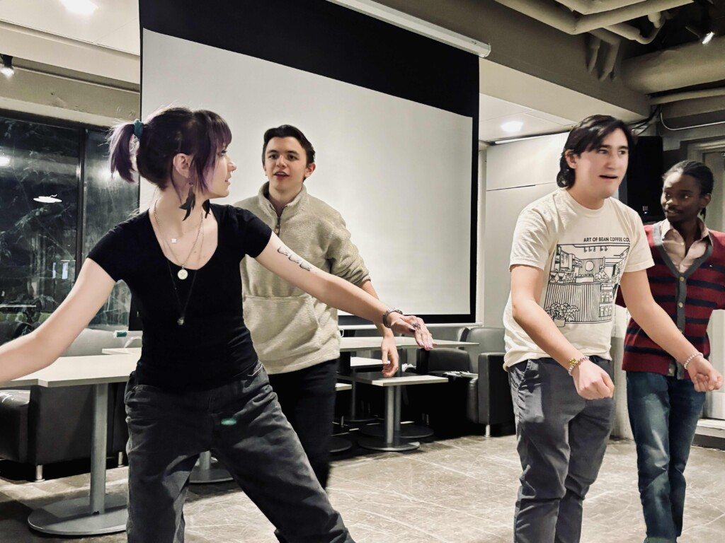 Students taking part in an Improv activity.