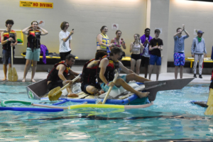 Students in their raft in the pool.