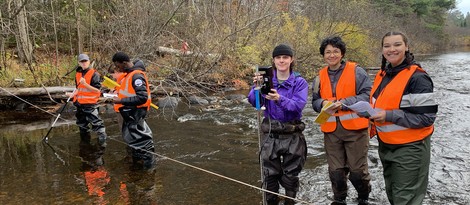 students taking water samples