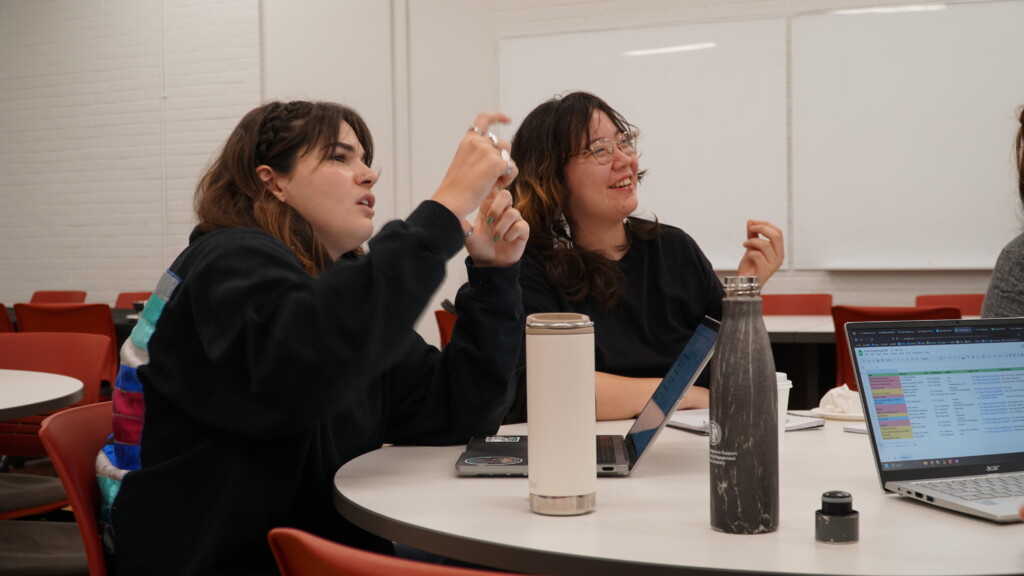 Two participant's having a discussion during a workshop.