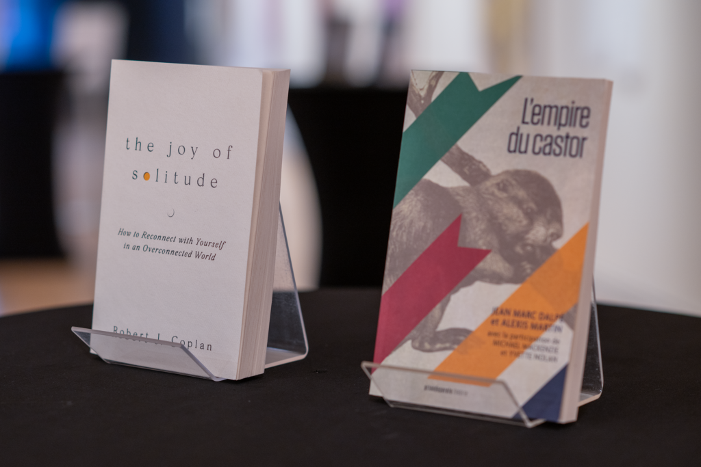 Two books: Robert J. Caplan's "The Joy of Solitude" and Jean Marc Dalpé and Alexis Martin's "L'empire du castor"