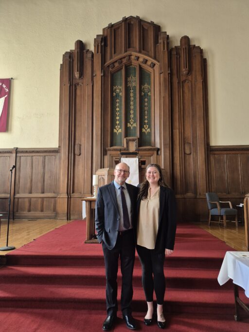 Discovery University Coordinator Emma Pratt stands with Reverend John Perkins of First Baptist Church