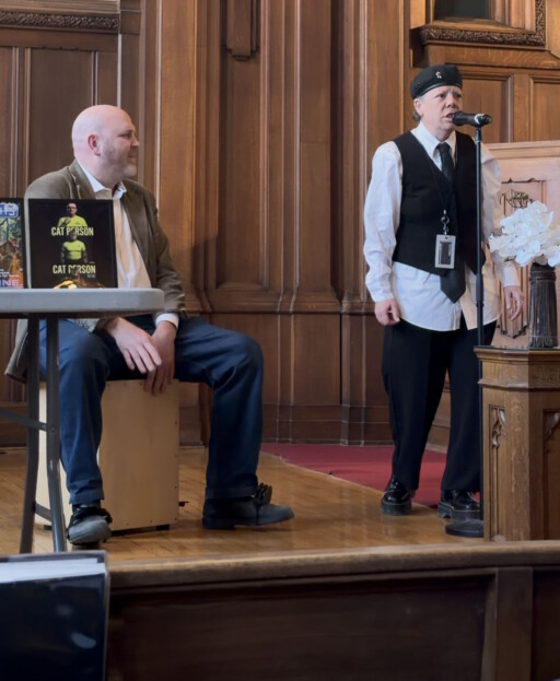 A Discovery University student performs alongside Music professor Jesse Stewart during the program’s graduation celebration.