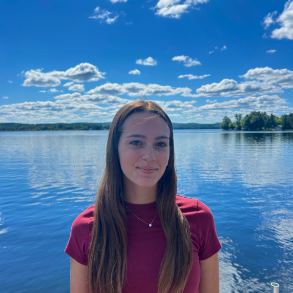 Student Ambassador standing in front of lake