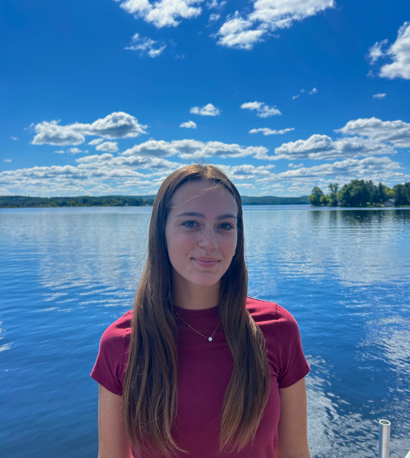 Student Ambassador standing in front of lake