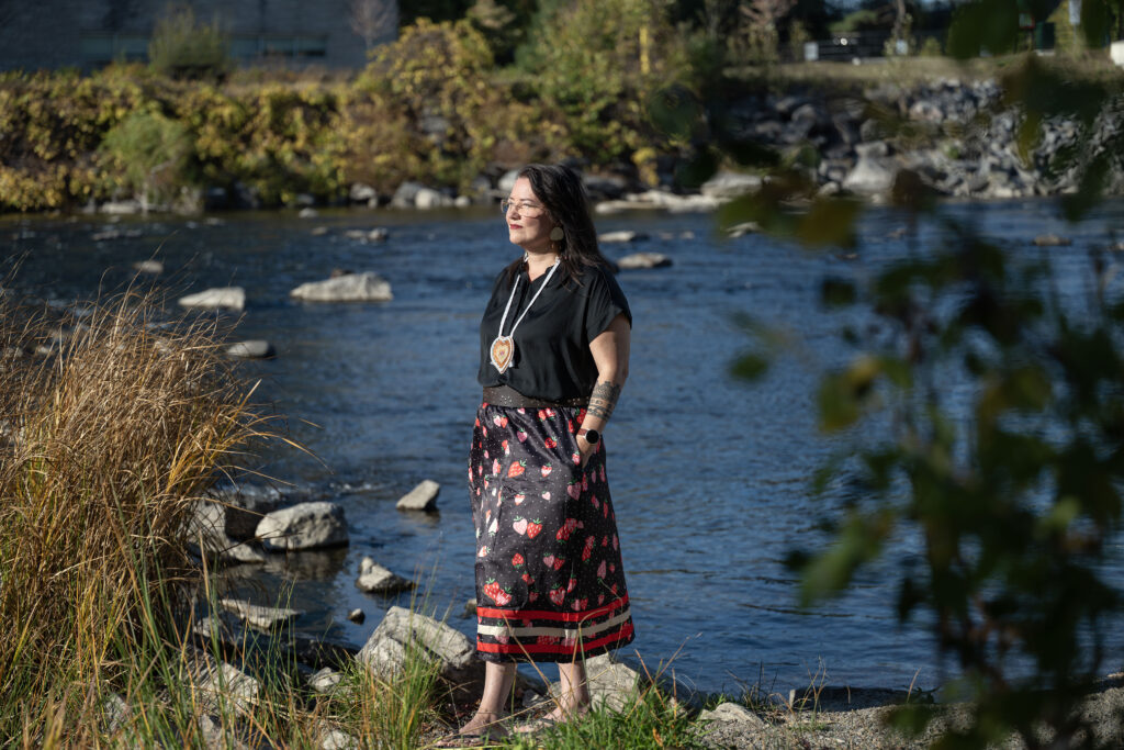 Dr. Kahente Horn-Miller by the river on campus