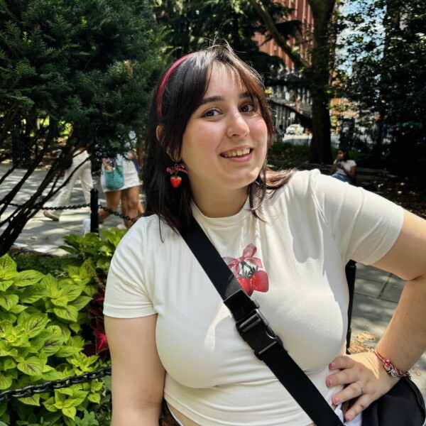 Student posing outside with hand on hip
