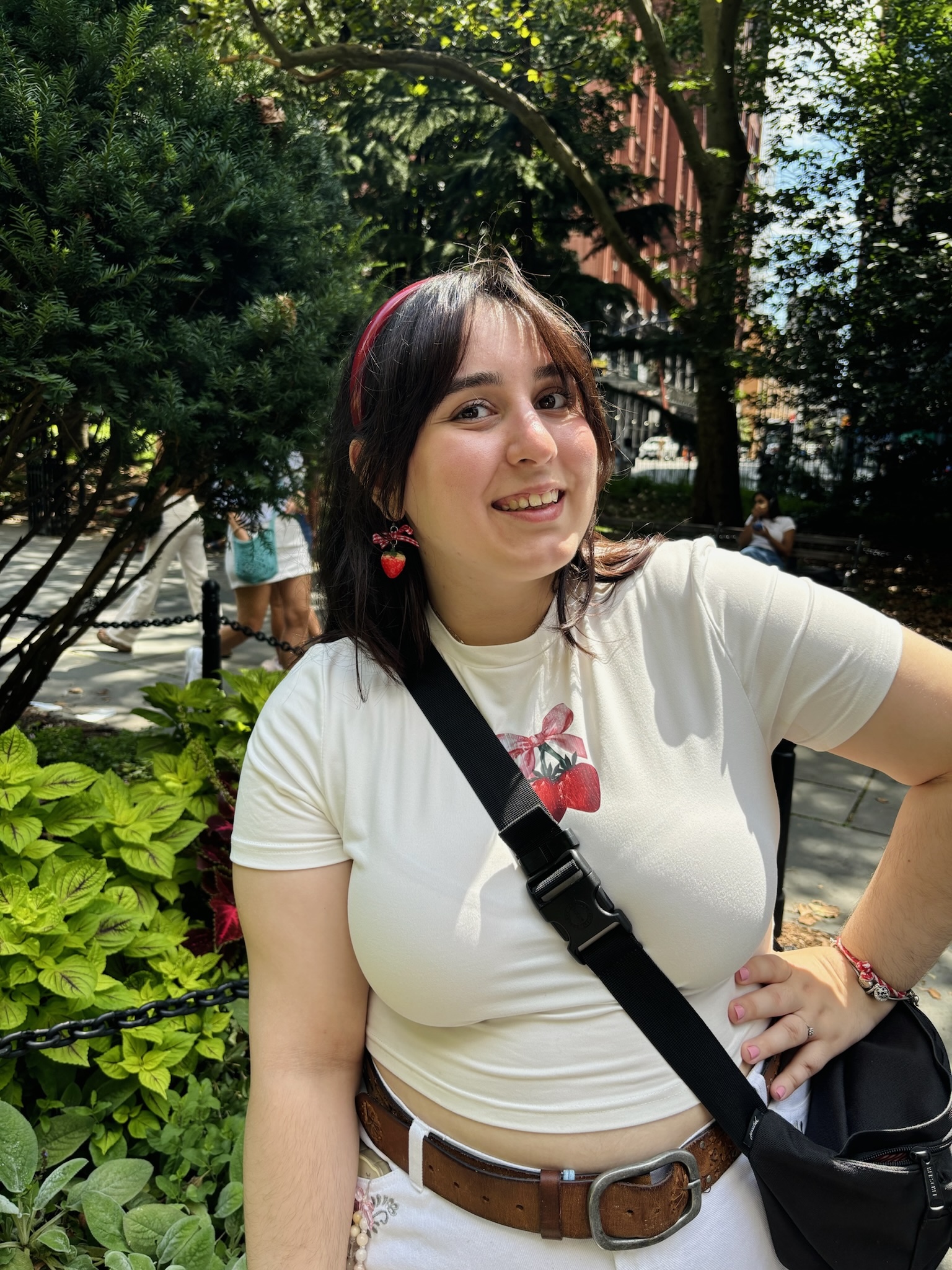 Student posing outside with hand on hip