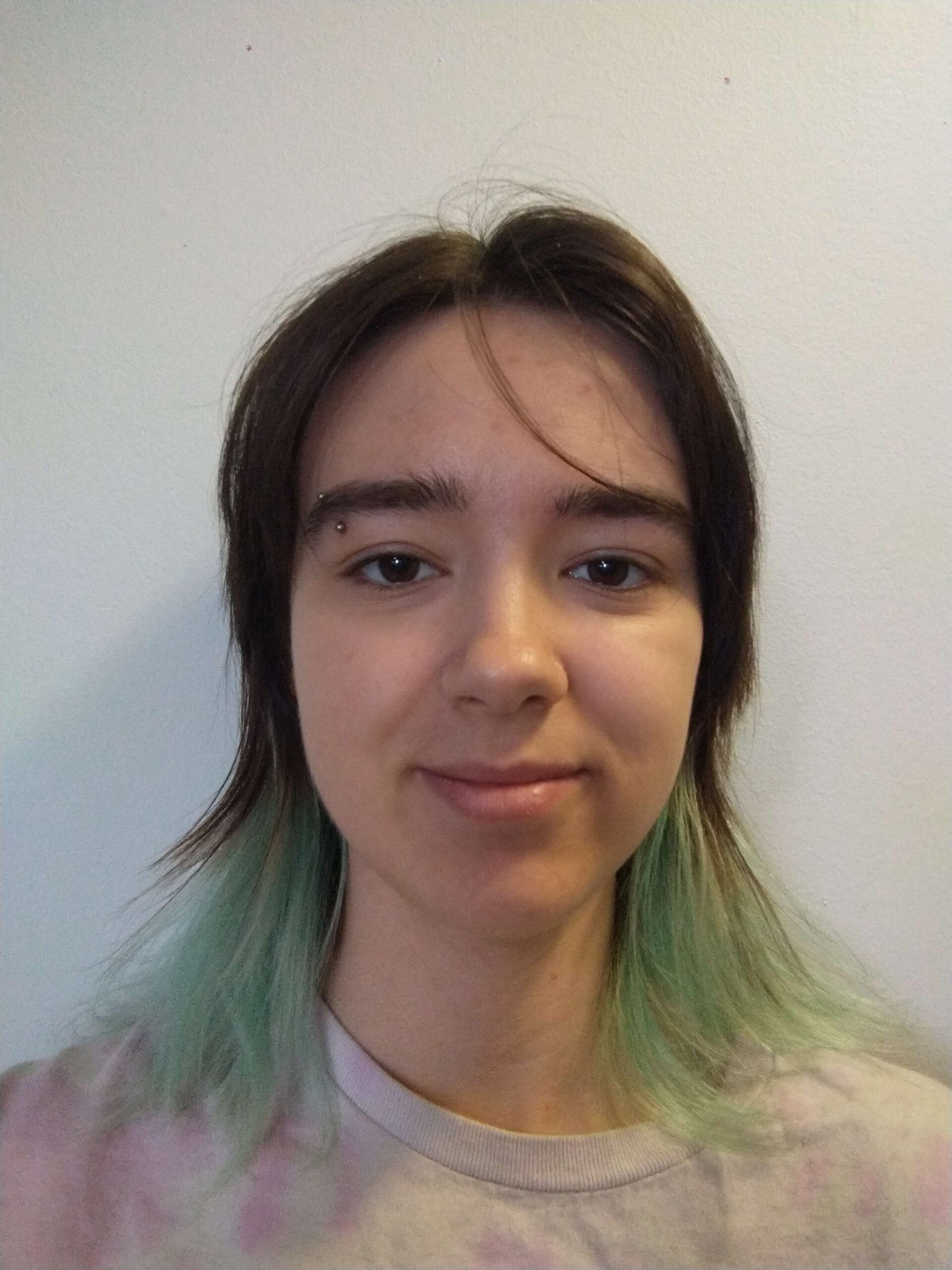Student with brown and green hair