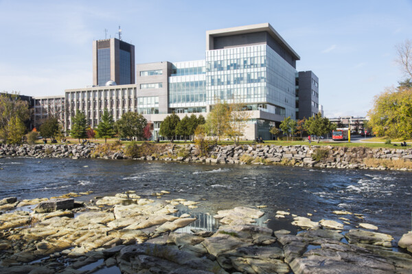 A view of Carleton's campus from across the Rideau River.
