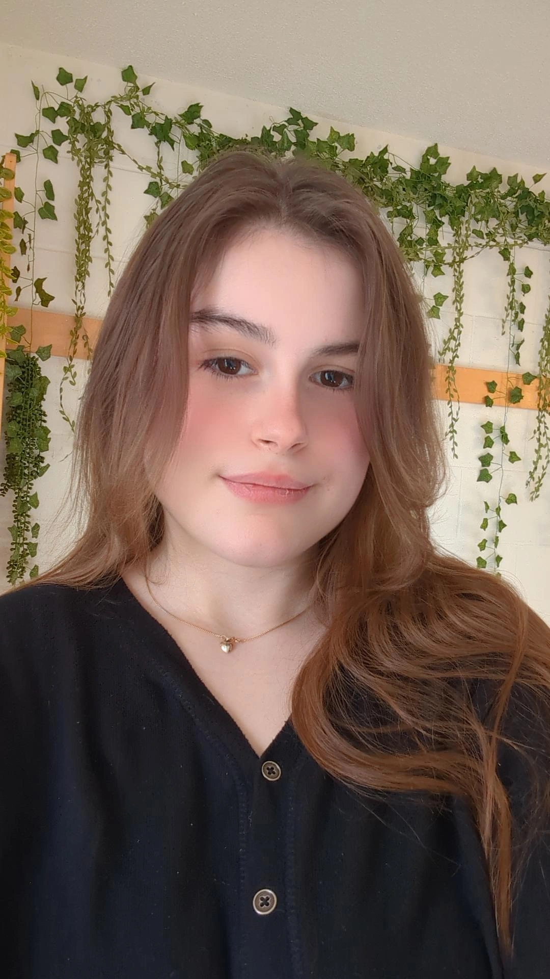 Student ambassador with brown hair and black sweater