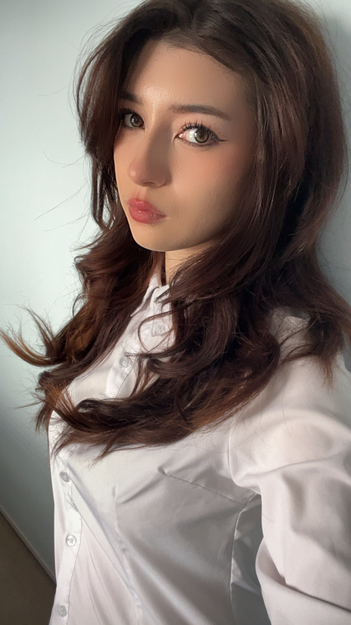 Student Ambassador with brown hair and white blouse