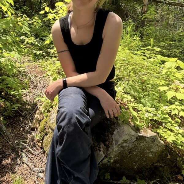 Student ambassador sitting in forest