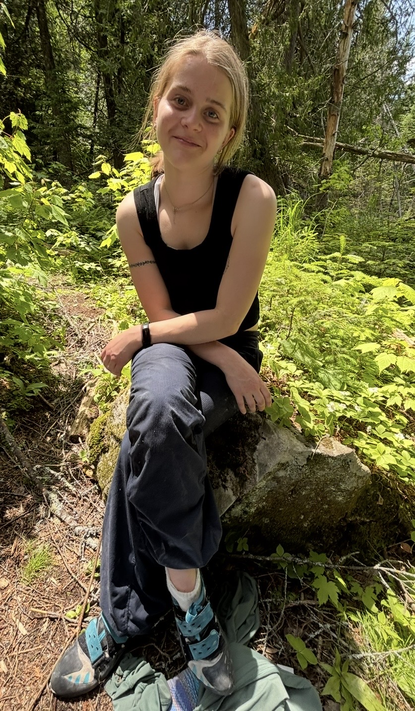 Student ambassador sitting in forest