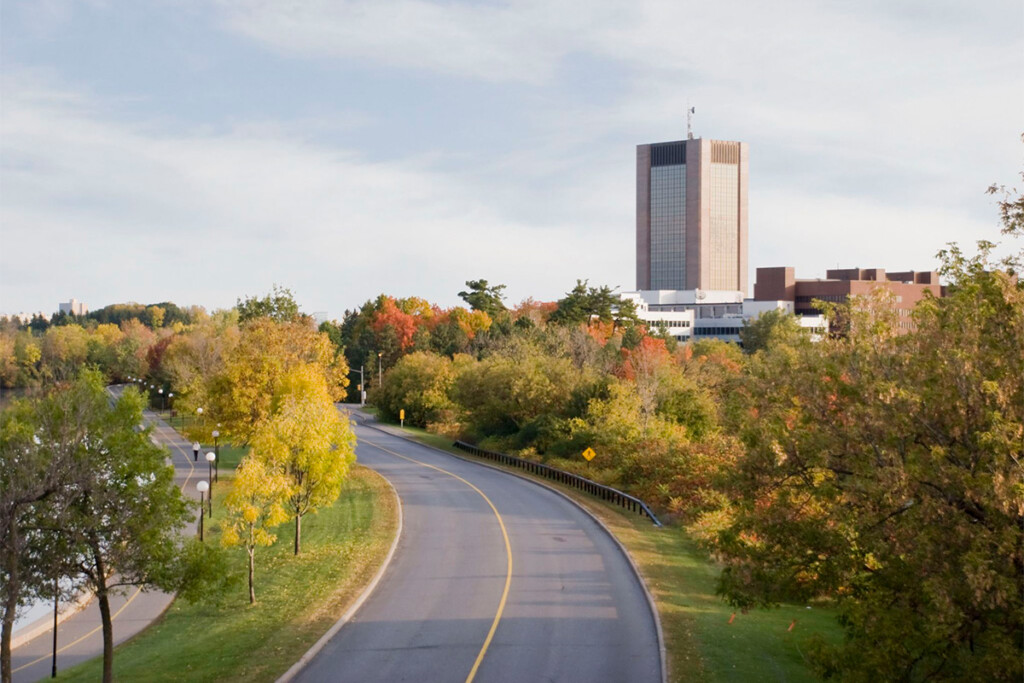 An aerial drone shot of Carleton's campus, featuring Dunton Tower.