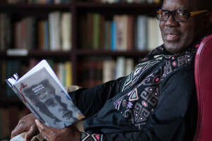 Prof. Nduka Otiono holding his new book