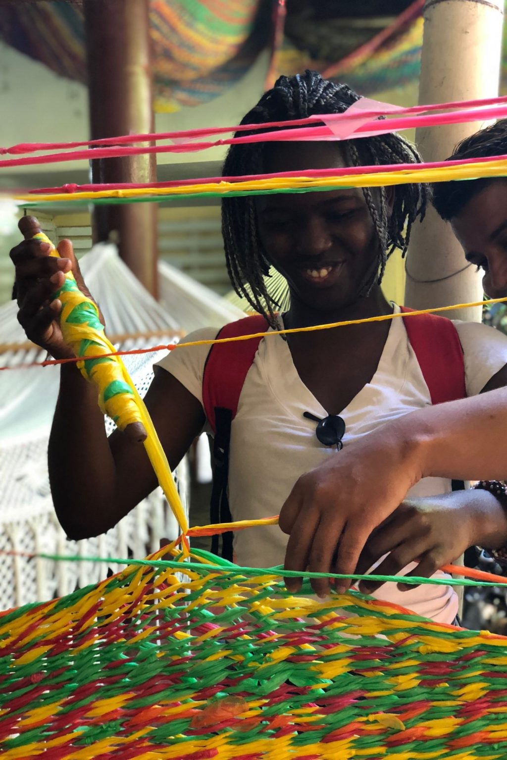 students being taught how to weave baskets
