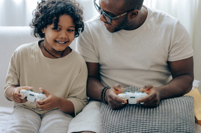 child and parent playing video games