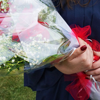 Graduate with bouquet