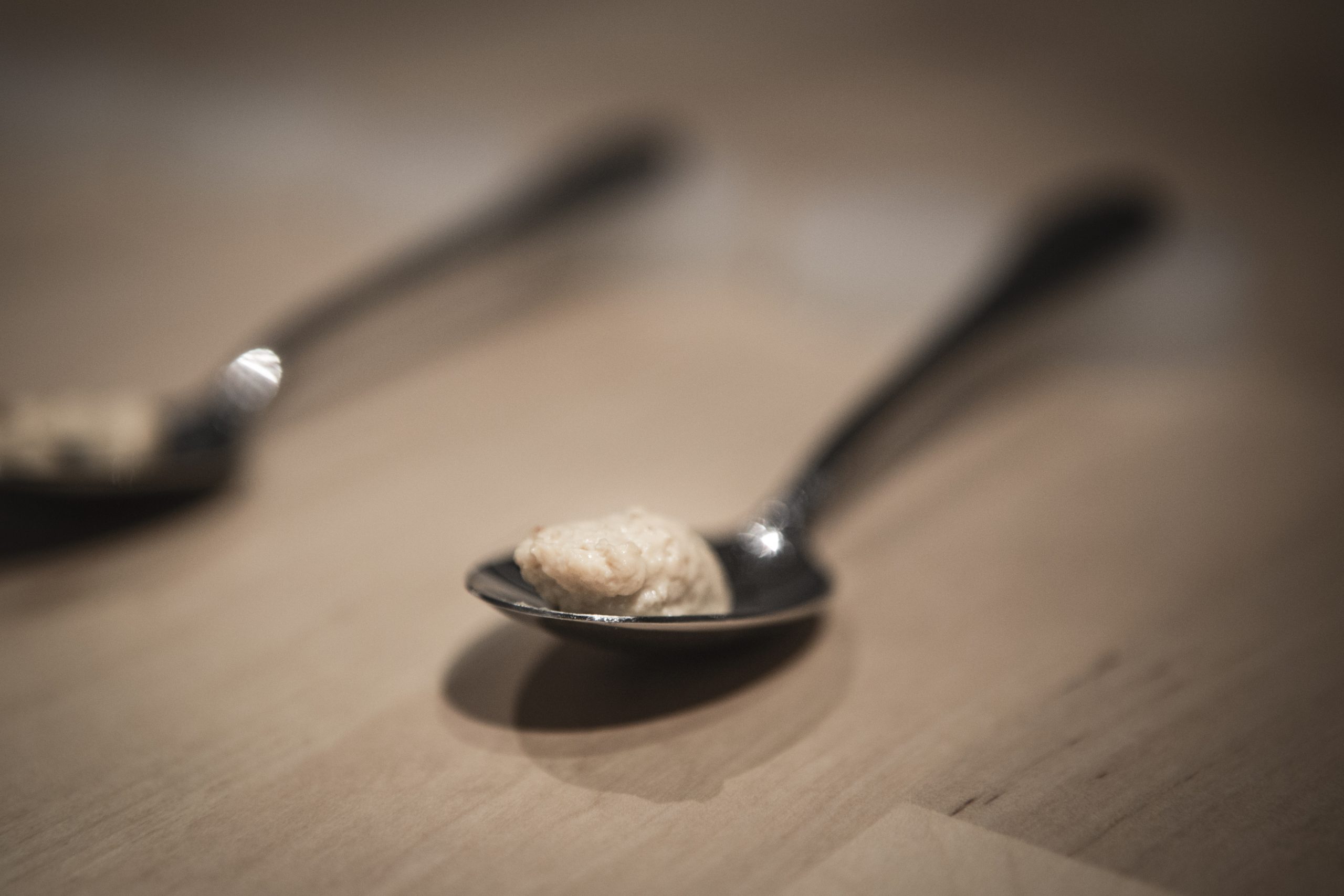 A closeup of the paste on a spoon.