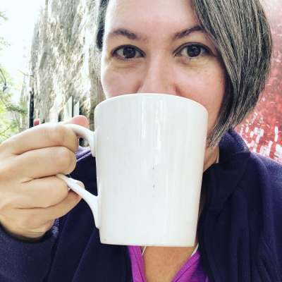 Jeni Armstrong sips from her coffee mug.