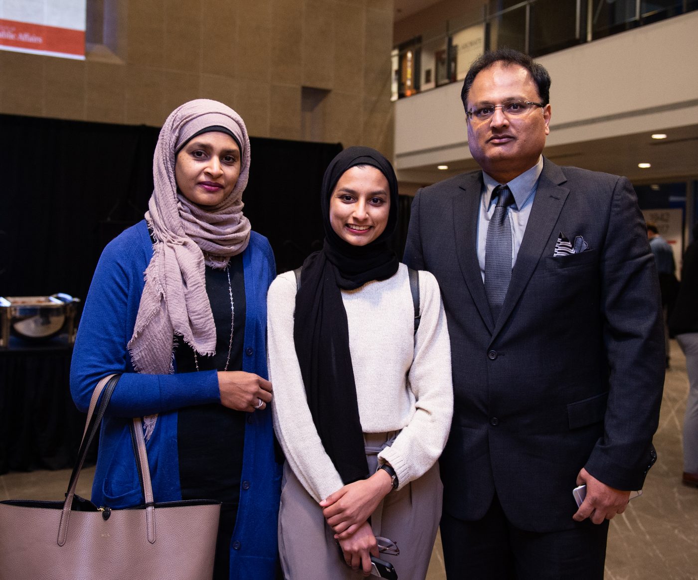 Zaiba Ali poses with her parents.