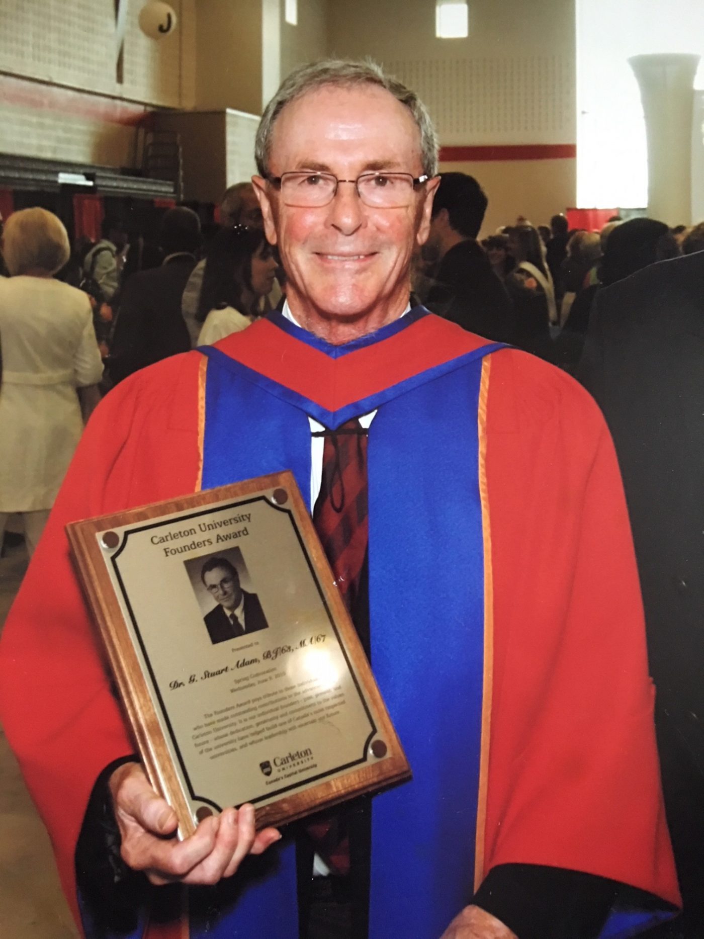 G. Stuart Adam poses in his academic gown after winning the Carleton University Founders Award.