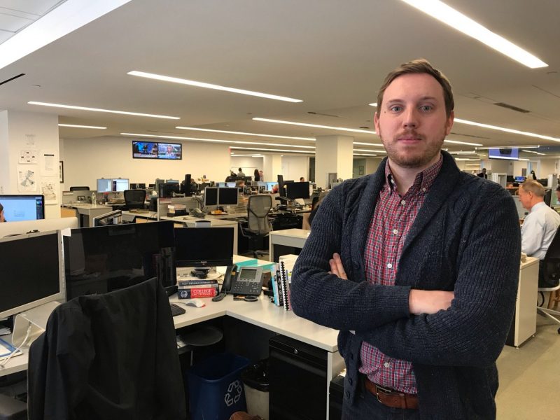 Joel Eastwood stands in the newsroom of The Wall Street Journal.