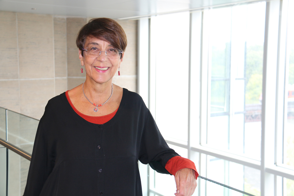 Professor Cristina Rojas stands in Richcraft Hll at Carleton University.