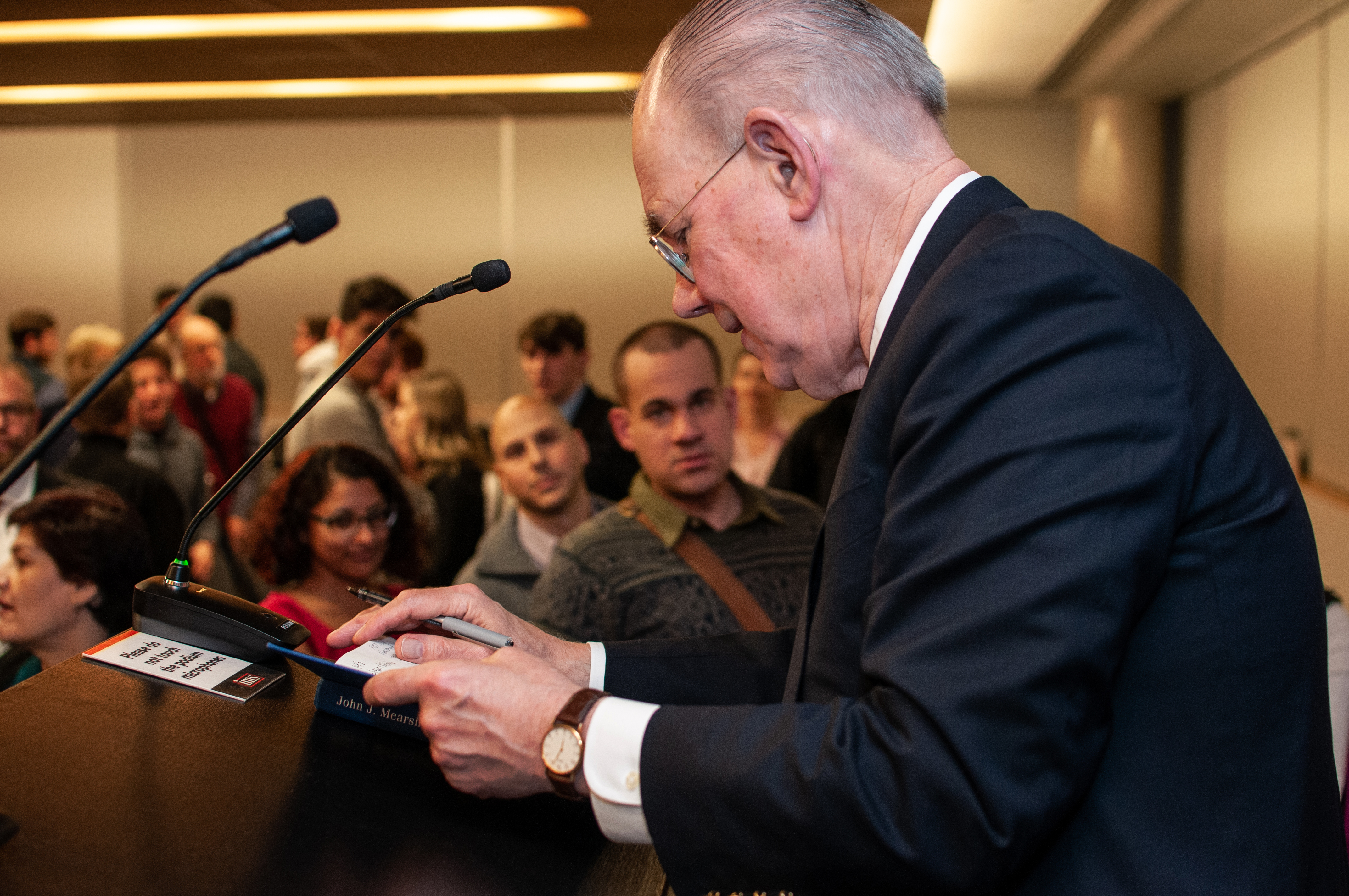 John Mearsheimer signs autographs after his lecture.