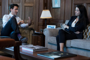 Justin Trudeau speaking in an office