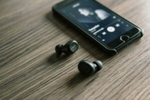 Spotify on mobile phone with ear buds