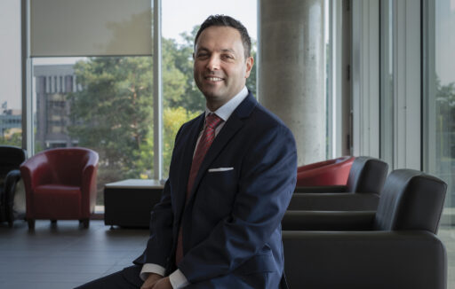 Daniel Rosenbloom poses against a background of Richcraft Hall