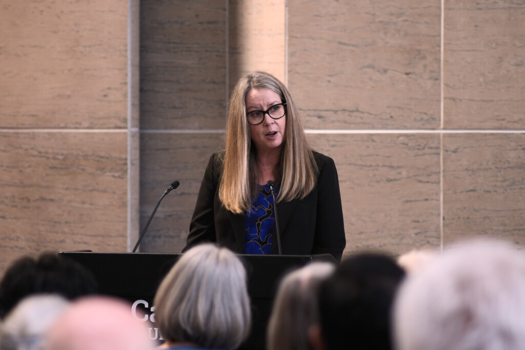 Interim Dean, Mary Francoli at the podium suring the 2026 Bell Lecture