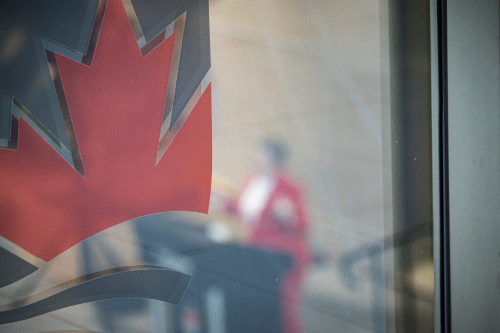 Artistic shot of the Carleton logo with a blurred Honourable Chrystia Freeland in the background