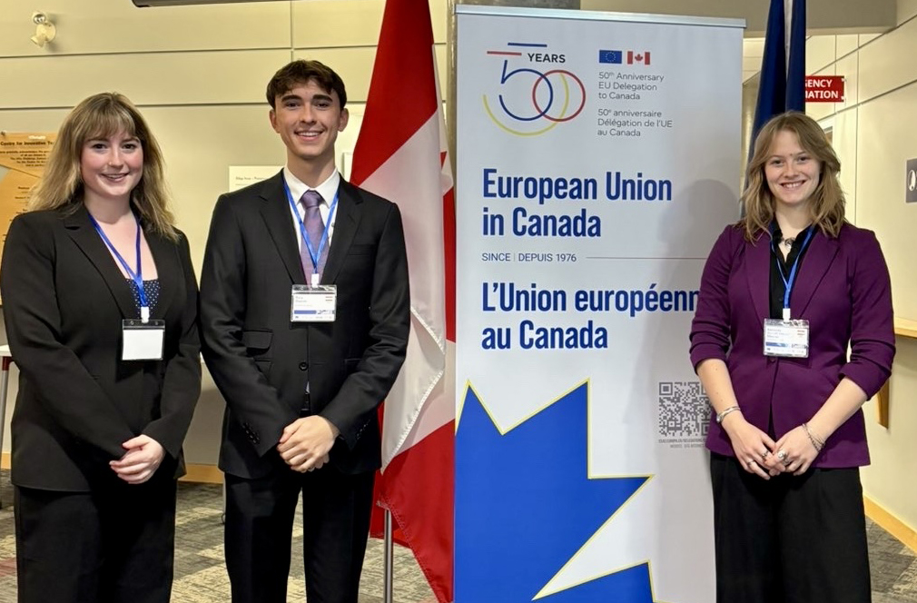 Three Carleton Political Science students pose at the Canadian Model EU