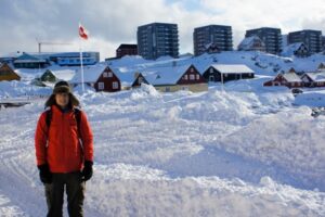 Standing by the harbor in Nuuk’s Old Town on a clear day. Note the more traditional Scandinavian-style houses in the mid-ground, with larger modern residential buildings in the background. Photo credit: Jill Rajewicz