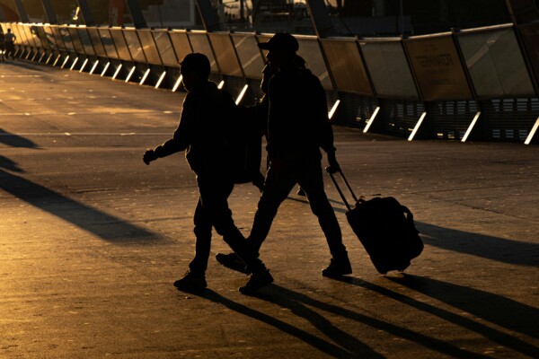 Photo of two travellers at dusk