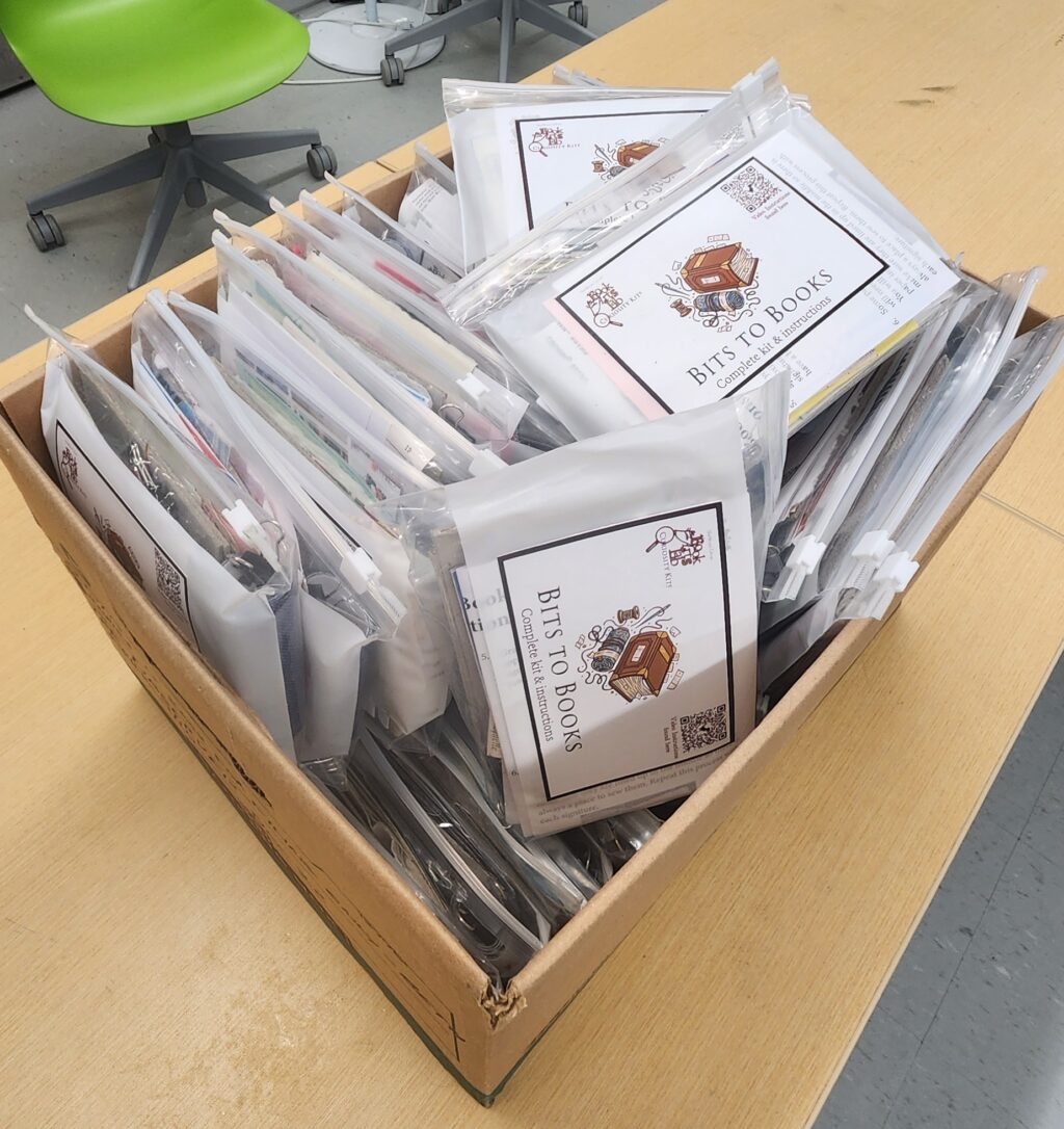 A box filled with Curiosity Kits in the Book Arts Lab at Carleton University's MacOdrum Library.