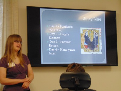 Allison Kuhl presenting in front of a PowerPoint presentation