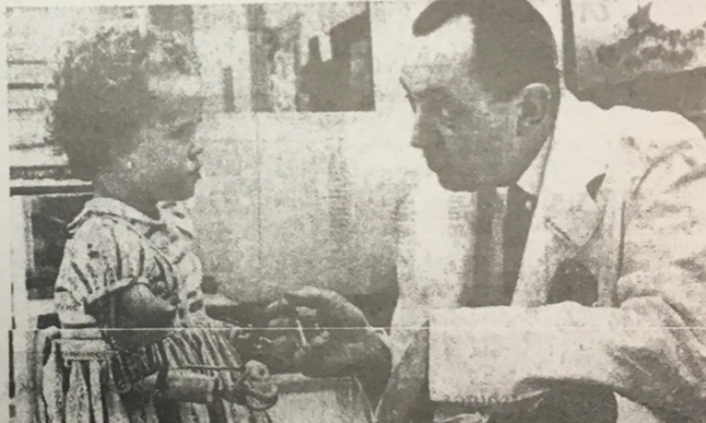 black and white photo of a man and a young child