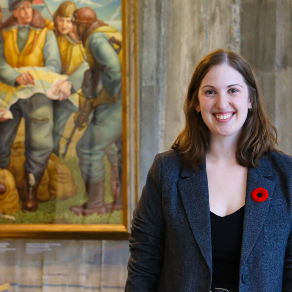 Sarafina Pagnotta standing next to a painting
