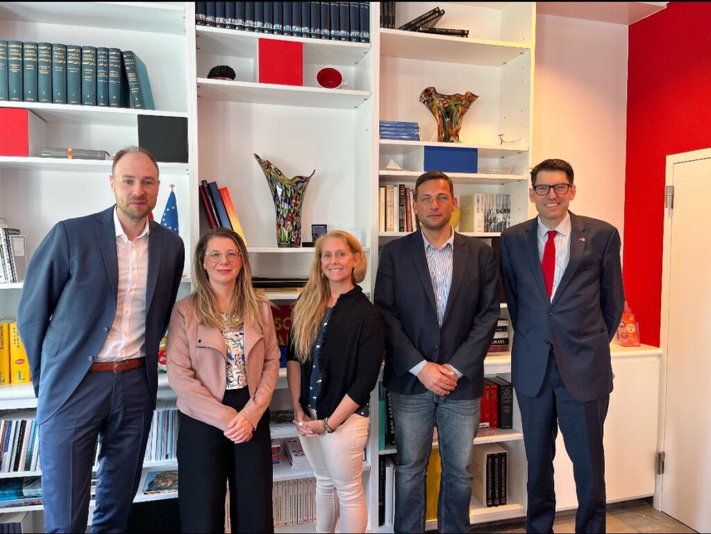 Jennifer Evans standing with Ambassador and others