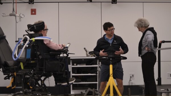 People standing in a gym talking