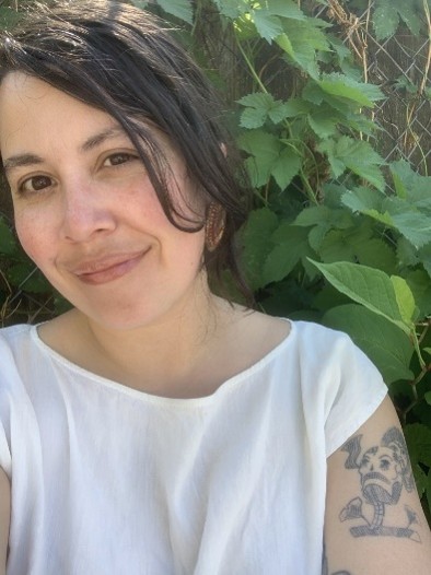 Emily Guerrero headshot in front of a tree